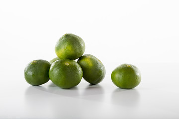 Delicious tangerines are showing off front of the white background