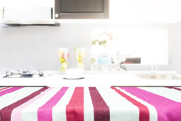 Empty wooden table and blurred kitchen background for display or montage your products