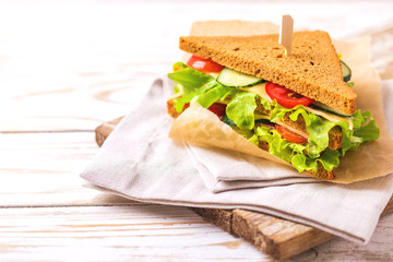 Rye bread sandwich with ham, cheese, lettuce