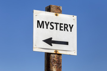 Mystery word and arrow signpost