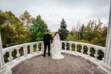 The bride and groom holding hands