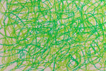 green crayon doodles drawing on brown paper