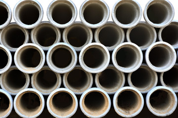 Concrete pipe for house poles in construction shop.