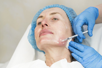 Cosmetic treatment with injection in a clinic 