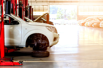 white car repair station with soft-focus in the background and over light