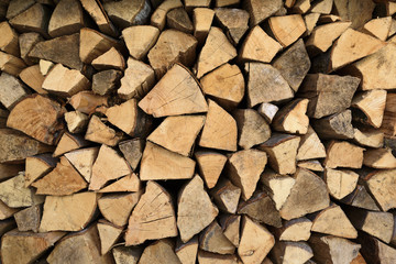 Chopped firewood woodpile close-up background