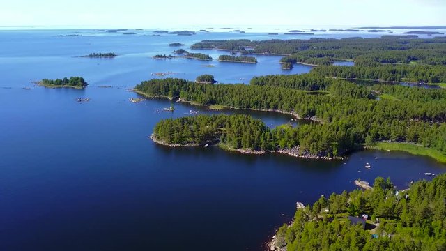Beautiful views of the coastline and the islands of the archipelago on a clear sunny day. 4K aerial video.