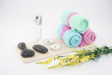 Obraz na płótnie Canvas Spa and aromatherapy concept on white background. Zen stones, accessories used in aromatherapy. 