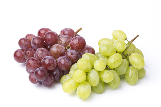 A bunch of green and red grapes isolated in a white 