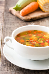 Vegetable soup in bowl on wooden table
