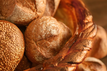 Braided bread basket with delicious buns, closeup