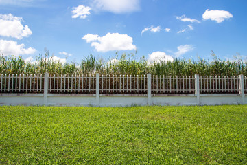 beautiful of fence factory in industrial estate,green field and stone with blue sky and cloud as...