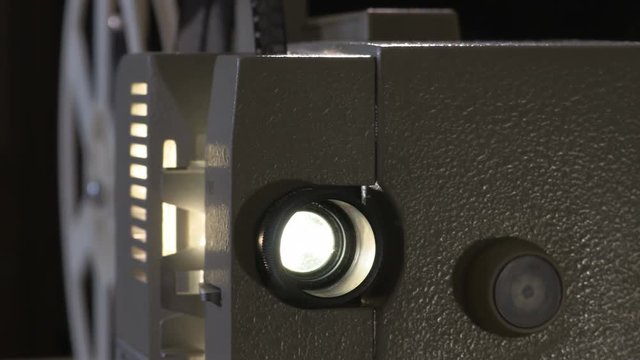 Amateur cinema. Projector for 8mm film. 1960s, 1970s, 1980s years. Home cinema. Film super 8. Footage clip 4k