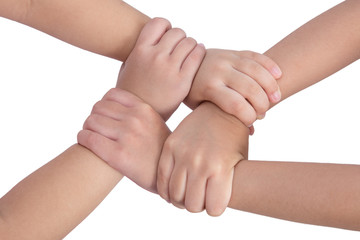 Four child's hands crossed and holding each other