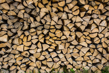 Stacked firewood on grass
