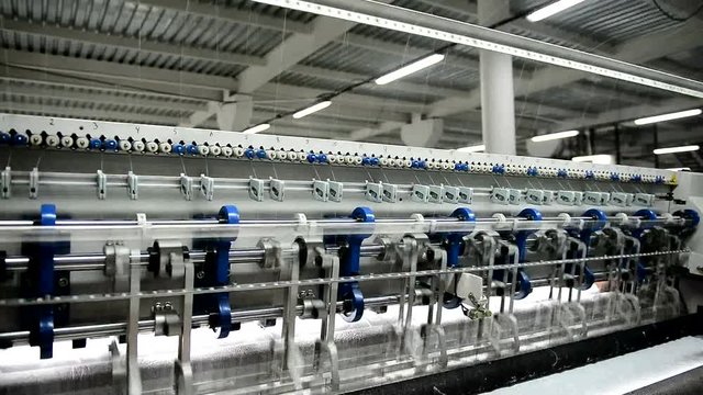 At a large factory a powerful quilting machine works. It is designed for the production of mattresses and quilting, as well as for making blankets, bedspreads and some leather products. Quilting