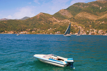 Fototapeta na wymiar Boats in Kotor Bay (Adriatic Sea) on a sunny summer day. Montenegro