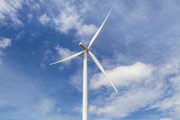 wind turbine generating electricity producing alternative energy with blue sky background