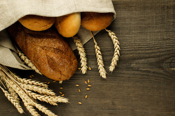 Bakery products in a linen napkin on a wooden surface