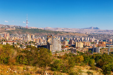 Fototapeta premium Yerevan, Armenia - 26 September, 2016: A view of Yerevan from Genocide memorial in sunny day and view on Ararat