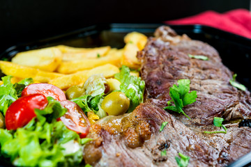 juicy steak beef meat with tomato and french fries