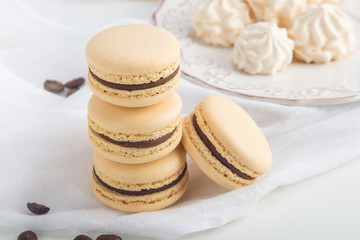 Coffee macarons with chocolate. French delicate dessert for Breakfast