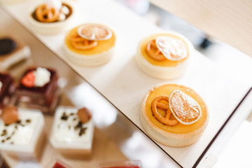 Selling cupcakes and muffins at the showcase in candy shop