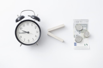 Business concept old vintage alarm clock money key. Time is money. Free money, waste time