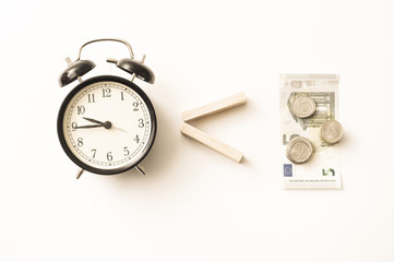 Business concept old vintage alarm clock money key. Time is money. Free money, waste time