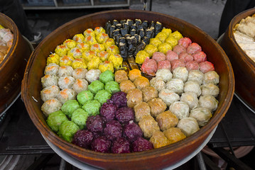 Colourful Steamed seafood dumplings cooking.