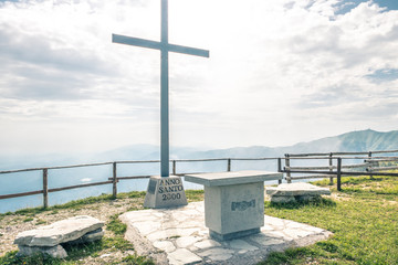 jesuscross on top of mountain view in italy