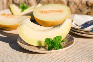 Melon slices simple and healthy summer dessert concept.