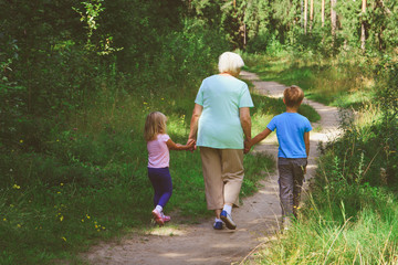 Fototapeta premium grandmother with kids walk in nature