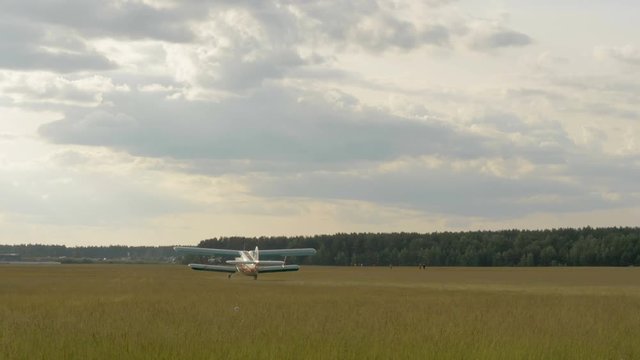 The plane take off from the field - slowmotion 60fps