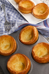 freshly baked yorkshire pudding in a baking tray