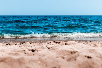 Sea view from tropical beach with sunny sky. Sea travel and holiday. Selective focus