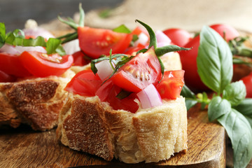 Bruschetta with tomatoes, herbs and oil on toasted garlic cheese bread toasted with chopped tomatoe