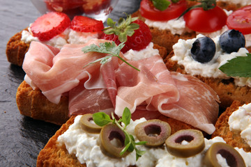 Italian antipasti wine snacks set. Cheese variety, Mediterranean olives, pickles, Prosciutto di...