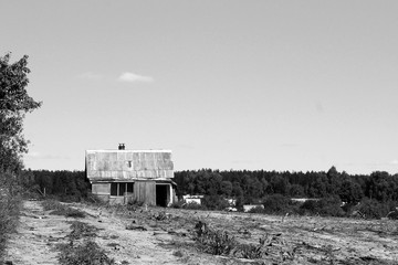 view of an abandoned wood house in black and white photography - Powered by Adobe