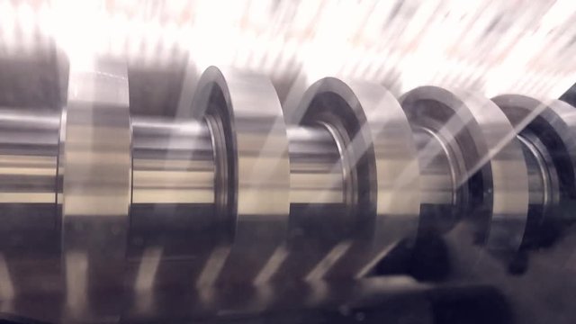 Slitting machine slitting label material for smaller rows.