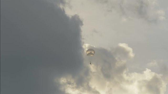 Skydiver landing with two parachutes - slowmotion 60fps