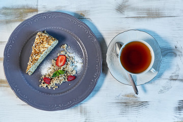 Tiramisu dessert on wooden table. Top view with copy space jpg