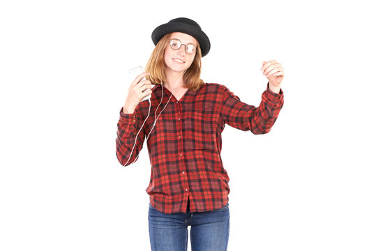 Portrait of teenage girl listening to music on smartphone