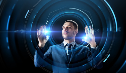 businessman with virtual projection over black