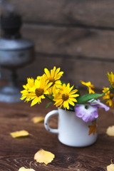 Summer yellow flowers in a white circle still life.