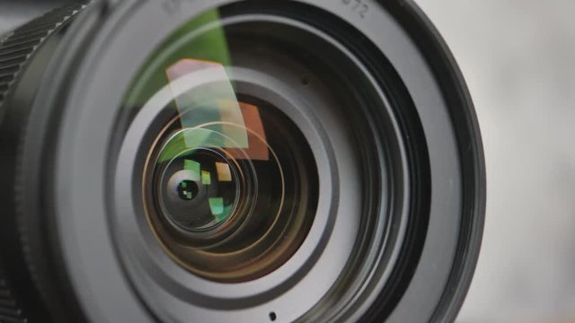 Close up of the camera lens with diaphragm camera shutter blade and sound. 