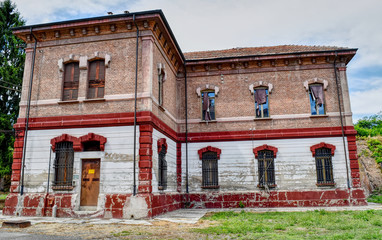 Abandoned and ruined buildings of the ancient damaged Cittadella of Alessandria in Italy. HDR effect.