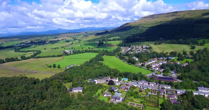 4K aerial footage of the rural village of Fintry in Scotland nestled beneath the Campsie Fells and Fintry Hills