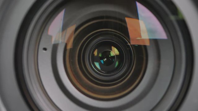 Close up of the camera lens with diaphragm camera shutter blade and sound. 