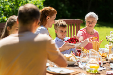 happy family having dinner or summer garden party